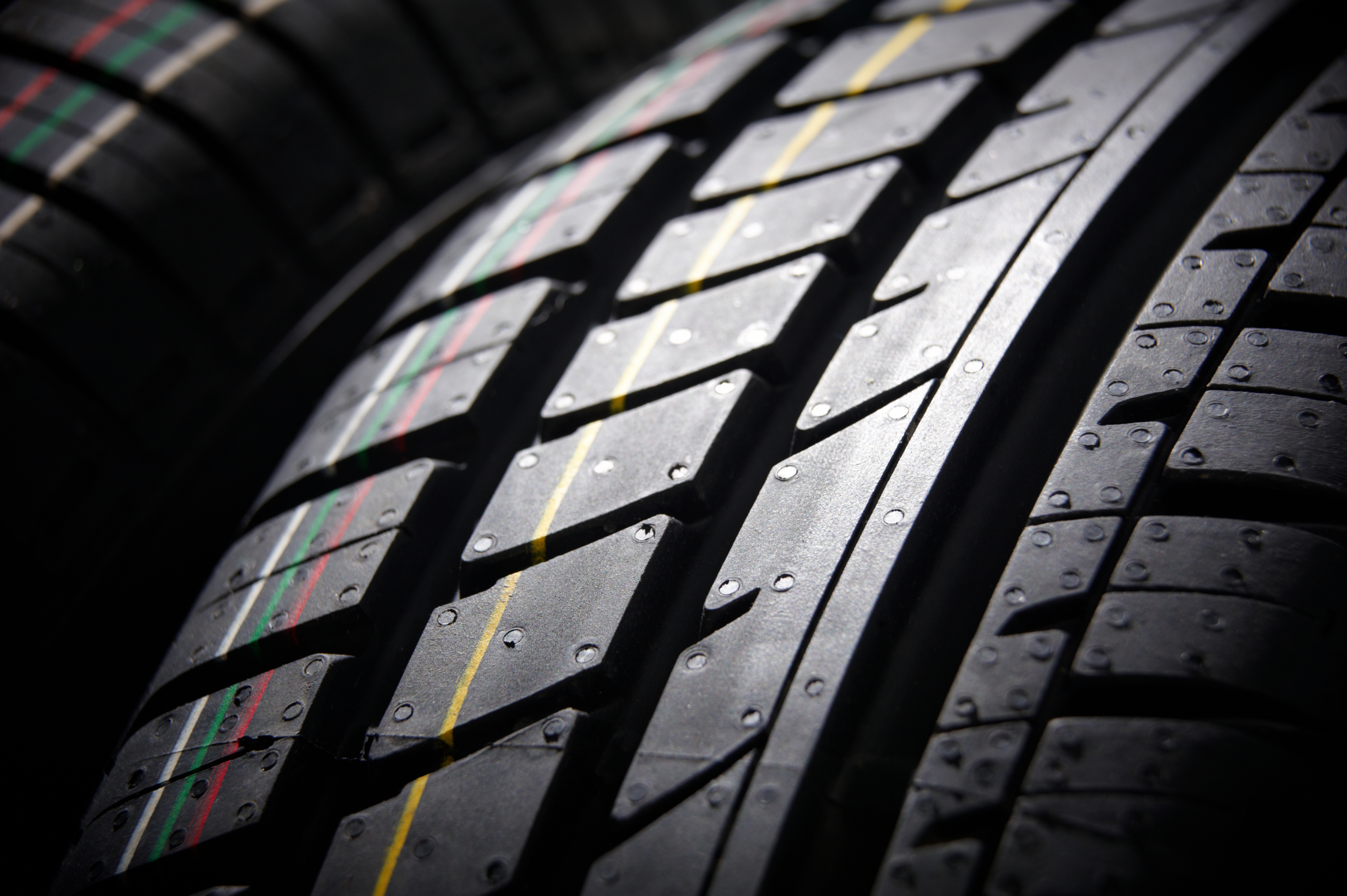 Set of summer tires on a clean studio backdrop