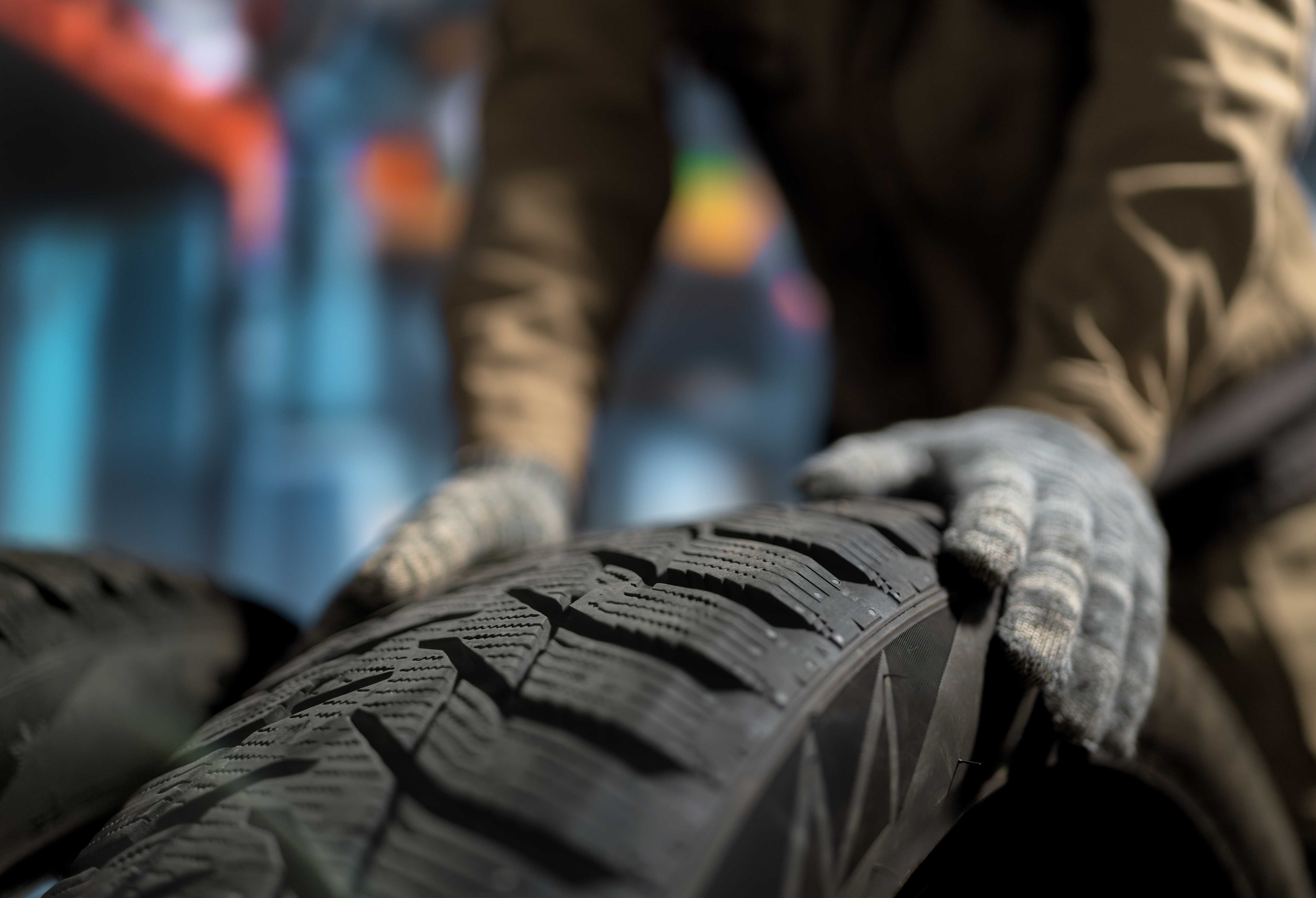 Mechanic handling a tire in the Kayuco shop